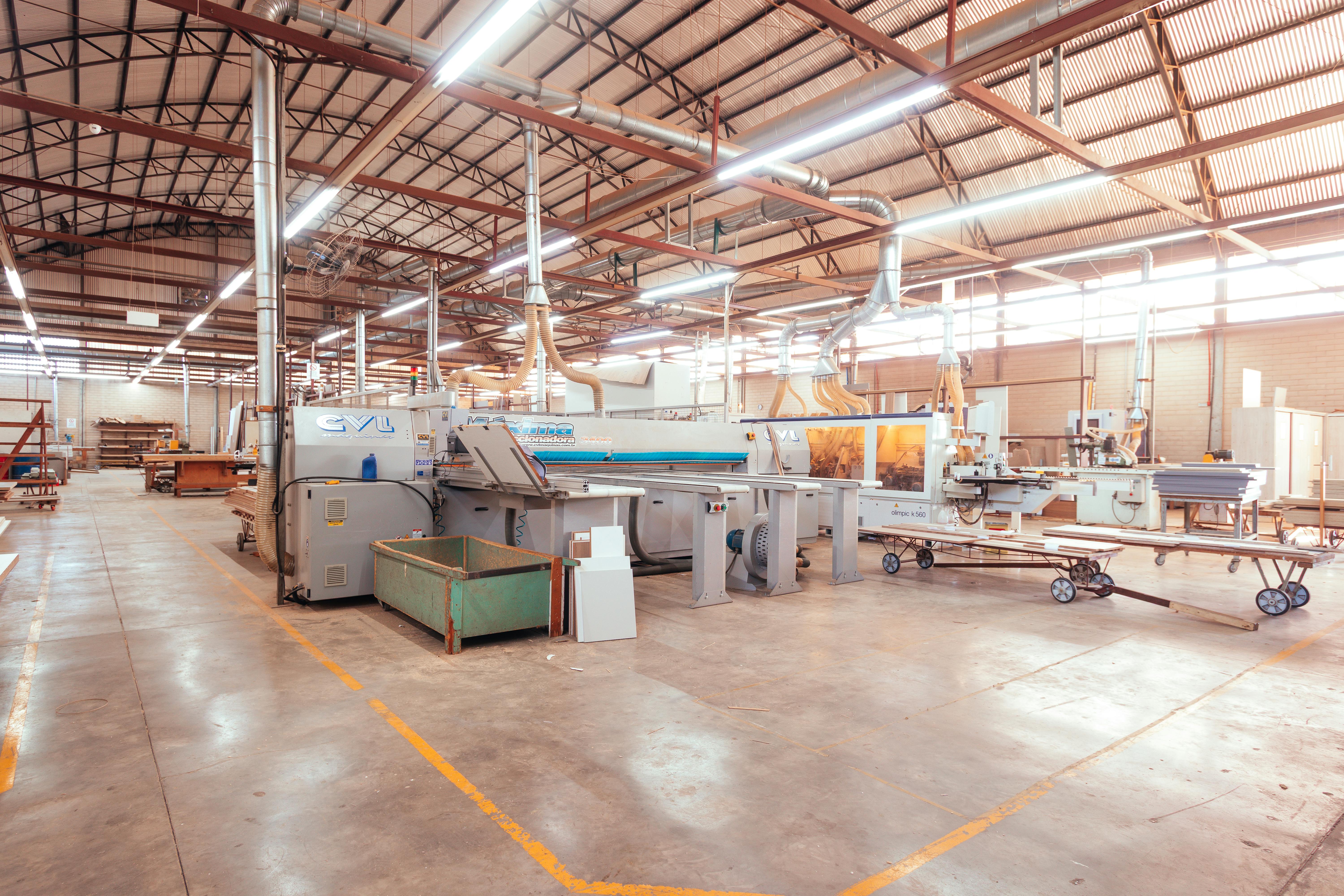 Factory floor with industrial machinery undergoing refurbishment